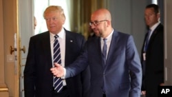 U.S. President Donald Trump speaks with Belgian Prime Minister Charles Michel prior to a meeting at the Royal Palace in Brussels, May 24, 2017. 