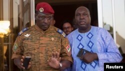 Lieutenant Colonel Yacouba Isaac Zida (L) meets with opposition leader Zephirin Diabre in Ouagadougou, capital of Burkina Faso, Nov. 2, 2014. 