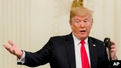 El presidente Donald Trump durante una ceremonia en el Salón Este de la Casa Blanca en Washington, el miércoles 22 de agosto de 2018.