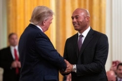 FILE - President Donald Trump shakes hands with former New York Yankees pitcher Mariano Rivera during ceremony presenting the Presidential Medal of Freedom to Rivera, in the White House, Sept. 16, 2019, in Washington.
