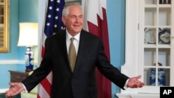 FILE - Secretary of State Rex Tillerson gestures as he responds to a reporter's question during a meeting with Qatar's Foreign Minister Sheikh Mohammed bin Abdulrahman Al Thani at the State Department in Washington, July 26, 2017. Tillerson surprised reporters Aug. 1, 2017, by joining their daily briefing for the first time. 