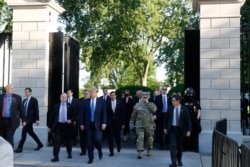 FILE - President Donald Trump walks from the gates of the White House to visit St. John's Church across Lafayette Park, June 1, 2020.