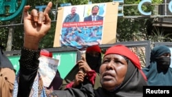 A woman reacts during a protest of Somali women who say their sons have been used as fighters in the Tigray conflict in neighboring Ethiopia, in Mogadishu, Somalia, June 10, 2021.