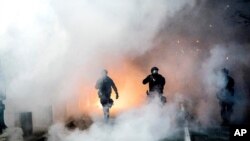 Federal officers use crowd control munitions to disperse Black Lives Matter protesters outside the Mark O. Hatfield United States Courthouse on July 21, 2020, in Portland, Ore.