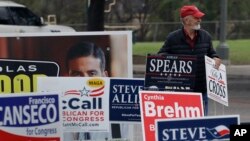 FILE - Election signs in San Antonio, Texas on Feb. 20, 2018. (AP Photo/Eric Gay)