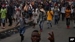 Protestors calling for the resignation of Haitian President Jovenel Moise march toward the National Palace before being stopped by police in Port-au-Prince, Haiti, Oct. 1, 2019. 