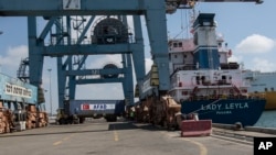 Containers are unloaded from Panama-flagged "Lady Leyla", a ship carrying Turkish humanitarian aid to Gaza, arrives at the port in the city of Ashdod, Israel, July 3, 2016. T
