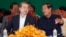 Cambodian Prime Minister Hun Sen, right, talks with Chinese Ambassador to Cambodia Xiong Bo, front left, during an inauguration ceremony of a sky bridge funded by China in Phnom Penh, July 2, 2018. 