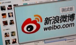 FILE - The logo of Sina Corp.'s Chinese microblogging site, Weibo, on a screen, Beijing, September 2011.