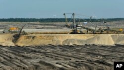 The Welzow-Sued open-pit coal mine, 70 miles south of Berlin, is one of several in eastern Germany’s Lusatia region. It is expected to expand in the coming years and consume the village of Proschim, just over a mile away.