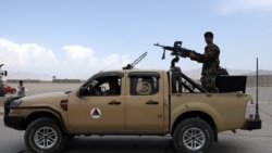 FILE - Afghan army soldiers patrol after the American military left Bagram Airfield, in Parwan province, north of Kabul, Afghanistan, July 5, 2021.
