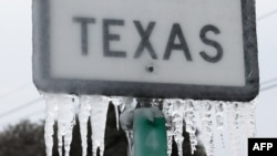 KILLEEN, TEXAS - FEBRUARY 18: Icicles hang off the State Highway 195 sign on February 18, 2021 in Killeen, Texas. Winter storm Uri has brought historic cold weather and power outages to Texas as storms have swept across 26 states with a mix of…