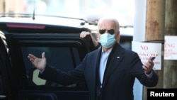 U.S. President-elect Joe Biden reacts to a journalist's question while exiting The Queen theatre following a virtual meeting with frontline health care workers in Wilmington, Delaware, Nov. 18, 2020.