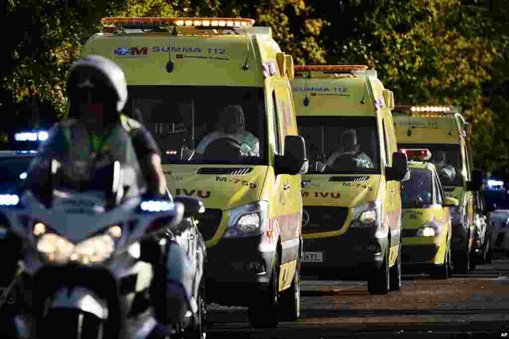 An ambulance transporting Miguel Pajares, a Spanish priest who was infected with the Ebola virus while working in Liberia, leaves the Military Air Base of Torrejon de Ardoz, near Madrid, Spain, Aug. 7, 2014.