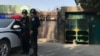 Police officers on duty in the vicinity of a center believed to be used for re-education in Korla in western China's Xinjiang region, Nov. 2, 2017.