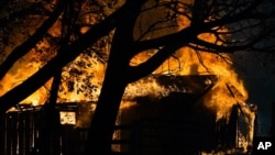 A structure is damaged by the CZU August Lightning Complex Fire in Aug. 20, 2020, in Bonny Doon, Calif.