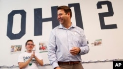 Democrat Danny O'Connor, the Franklin County recorder, meets with volunteers at his campaign headquarters, Tuesday, Aug. 7, 2018, in Columbus. 