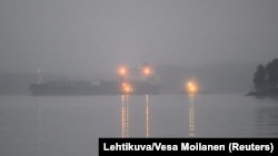 Oil tanker Eagle S is escorted by a tugboat to the Port of Kilpilahti near the city of Porvoo, on the Gulf of Finland, Dec. 28, 2024. (Lehtikuva/Vesa Moilanen via Reuters)