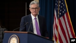 Federal Reserve Chairman Jerome Powell arrives to speak at a news conference, Wednesday, Jan. 30, 2019, in Washington.