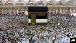 Muslim pilgrims circumambulate around the Kaaba, the cubic building at the Grand Mosque, ahead of the Hajj pilgrimage in the Muslim holy city of Mecca, Saudi Arabia, Wednesday, Aug. 7, 2019.