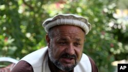 Aziz Rahman speaks to the Associated Press in Jalalabad city east of Kabul, Afghanistan, Oct. 1, 2019. Anger is rising over the increasing numbers of civilians dying in misdirected U.S. aerial strikes and heavy-handed tactics of CIA-trained Afghan force.