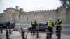 Security fencing and police outside Cardiff Castle ahead of the UK-based NATO summit, in Cardiff, Wales, Sept. 3, 2014.