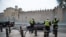 Security fencing and police outside Cardiff Castle ahead of the UK-based NATO summit, in Cardiff, Wales, Sept. 3, 2014.