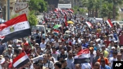 Egyptians chant slogans against the government and military rulers after Friday prayers, 230 kilometers north of Cairo, in Alexandria, Egypt, July 15, 2011