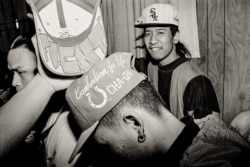Cambodian Gino smiles as he hangs out with his friends in Uptown, Chicago. (Photo: Stuart Isett)