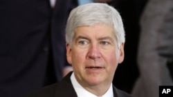 FILE - Michigan Gov. Rick Snyder speaks in Detroit. Snyder is under fire, accused of reacting too slowly to the water crisis in Flint.