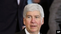 FILE - Michigan Gov. Rick Snyder speaks in Detroit. Snyder is under fire, accused of reacting too slowly to the water crisis in Flint.