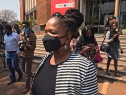 Beatrice Mtetwa, a member of Zimbabwe Lawyers of Human Rights, talks to reporters outside the Harare Magistrates Court in Harare, Zimbabwe, Aug. 18, 2020.