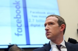 FILE - Facebook Chairman and CEO Mark Zuckerberg testifies at a House Financial Services Committee hearing in Washington.