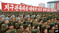 Korea Utara merayakan peluncuran peluru kendalinya pada 8 Feb 2016