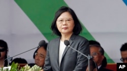 FILE - Taiwan's President Tsai Ing-wen delivers a speech during the National Day celebrations in front of the Presidential Building in Taipei, Taiwan, Tuesday, Oct. 10, 2017. 