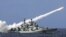  A Chinese warship launches a missile during a live-ammunition military drill held last year in the South China Sea. 