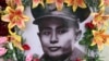 A portrait of Gen. Aung San is decorated with flowers during a ceremony marking the 70th anniversary of his 1947 assassination in Naypyitaw, Myanmar, July 19, 2017.