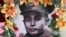 A portrait of Gen. Aung San is decorated with flowers during a ceremony marking the 70th anniversary of his 1947 assassination in Naypyitaw, Myanmar, July 19, 2017.