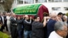 Relatives and friends carry the coffin of Salima Ayaz Merali, during her funeral, in Nairobi, Kenya, Sept. 25, 2013. Merali was killed alongside her daughter in last Saturday's Westgate Mall attack. 