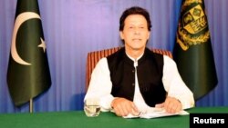 FILE - Pakistan's Prime Minister Imran Khan speaks to the nation in a televised address, in Islamabad, Pakistan, Aug. 19, 2018. 