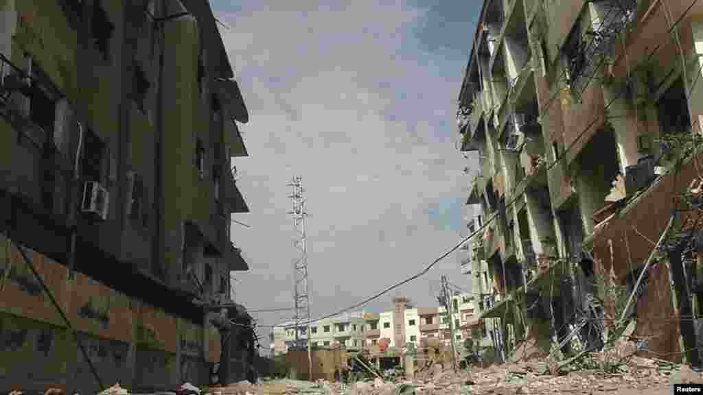 A view of buildings damaged by what activists said were missiles fired by a Syrian Air Force fighter jet, Daria, Syria, November 30, 2012. 