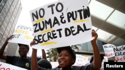 FILE - Environmental activists protest against the use of nuclear power in Durban, South Africa, Dec. 14, 2016. 