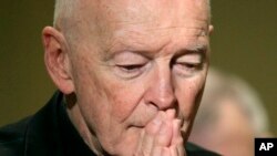 FILE - Cardinal Theodore McCarrick prays during the United States Conference of Catholic Bishops' annual fall assembly in Baltimore, Nov. 14, 2011. 