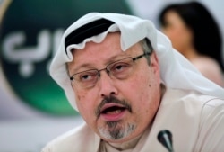 FILE - Saudi journalist Jamal Khashoggi speaks during a press conference in Manama, Bahrain, Feb. 1, 2015.