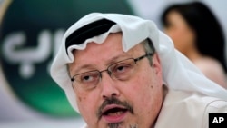 FILE - Saudi journalist Jamal Khashoggi speaks during a press conference in Manama, Bahrain, Feb. 1, 2015. 