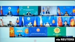 Foreign ministers and representatives of Association of Southeast Asian Nations (ASEAN) are seen on a screen during an informal meeting, in Putrajaya, Malaysia, March 2, 2021. 