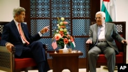 FILE - U.S. Secretary of State John Kerry (L) meets with Palestinian President Mahmoud Abbas.