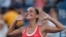 Roberta Vinci of Italy celebrates with the crowd after defeating Serena Williams of the US in their women's singles semi-final match at the US Open Championships tennis tournament in New York, Sept. 11, 2015.