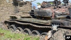 Tanks that have been destroyed during fighting between forces of Salva Kiir and Riek Machar, on July 10, 2016 in Jabel area of Juba, South Sudan, Saturday, July 16, 2016.