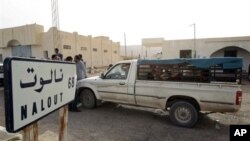 A van crosses the Tunisian-Lybian border of Dhuheiba, Tunisia, Thursday, April 21, 2011.